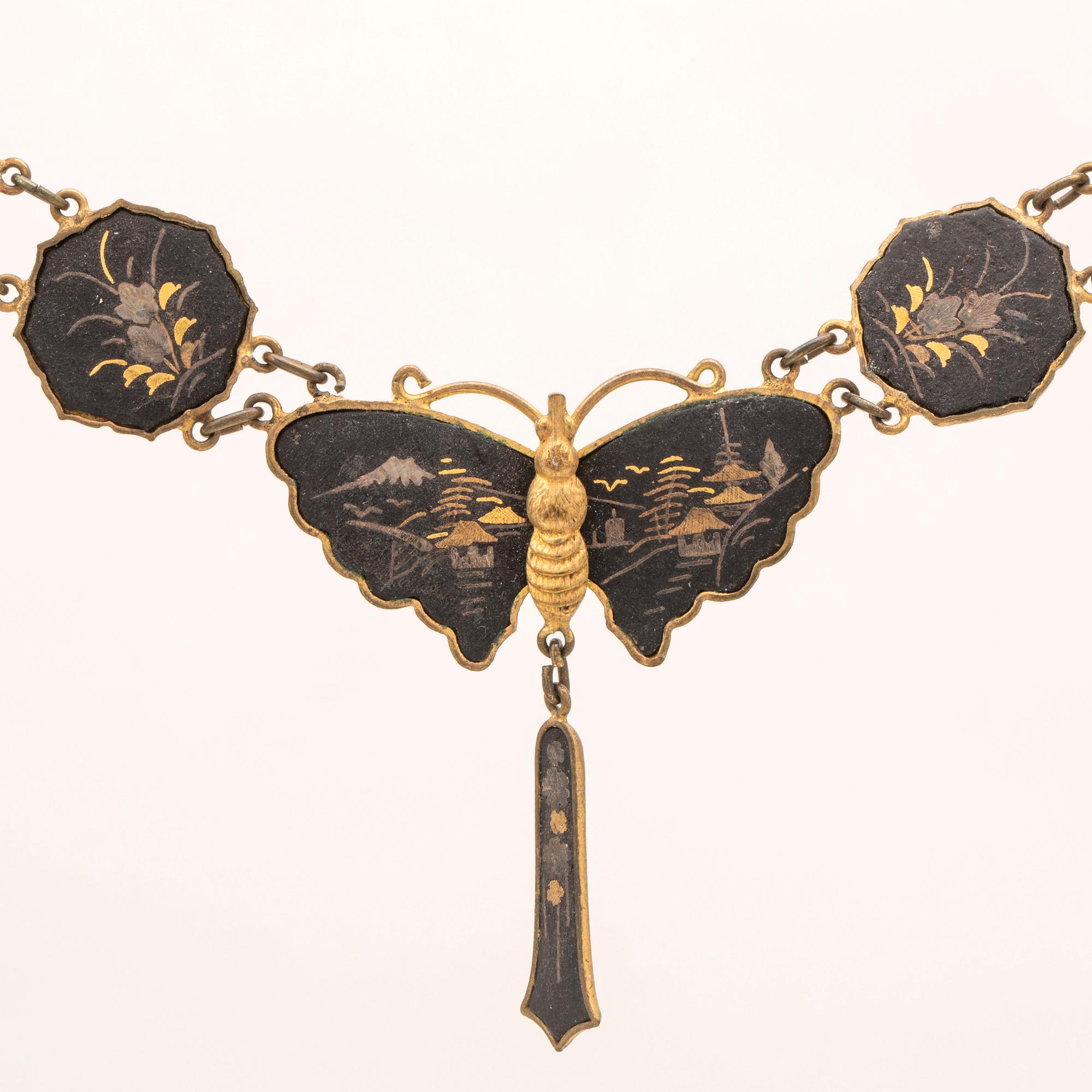 A silver-plated, gilded and lacquered metal parure from Japan, first half of the 20th century.