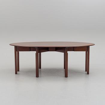 A DINING TABLE, England, made for NK, Nordiska Kompaniet, Sweden. Signed with label. Probably 1960s / 70s.