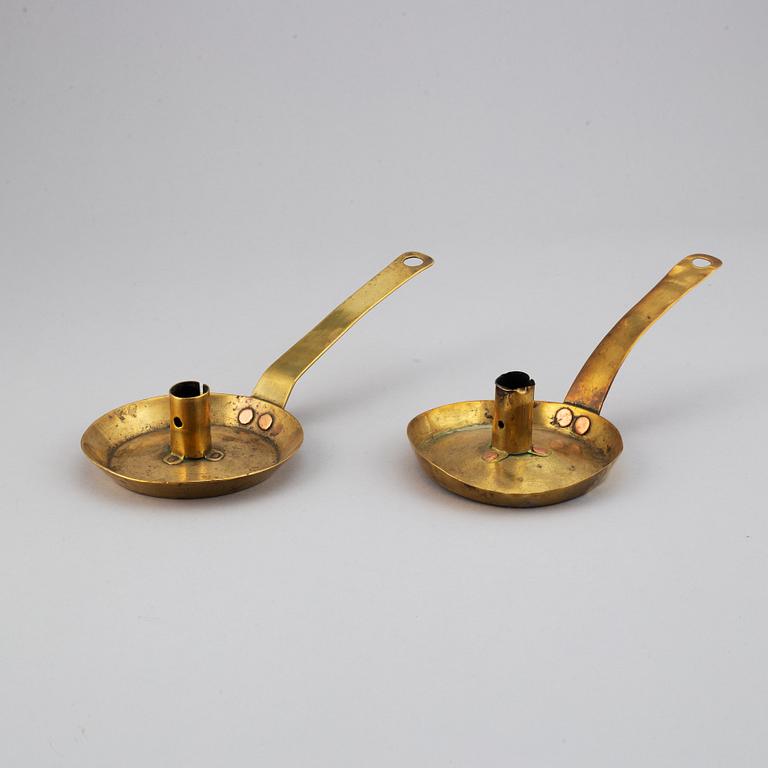 Four 18th century brass night light holders.