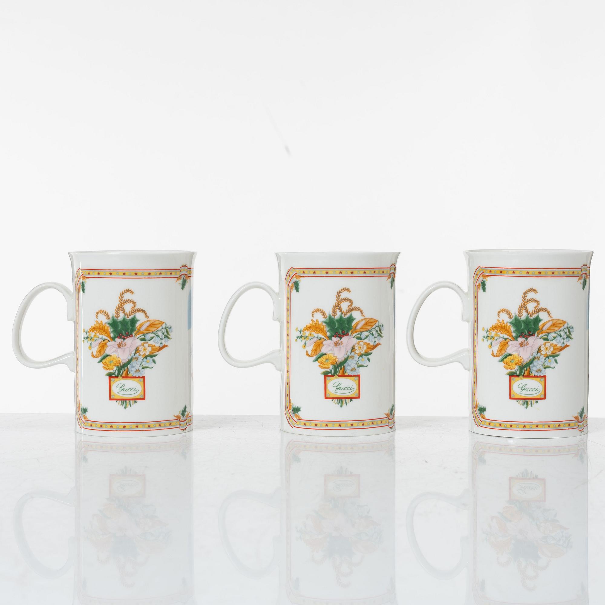 Gucci, A set of six vintage christmas mugs.