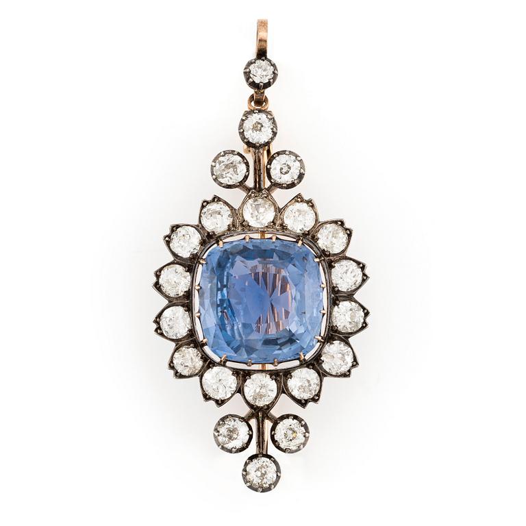 An gold and silver brooch/pendant with a sapphire and old-cut diamonds.