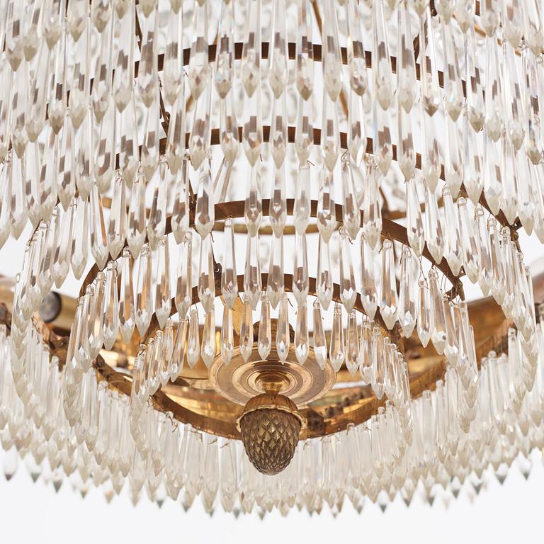A gilt brass and cut glass nine-light Empire chandelier, first part of the 19th Century.