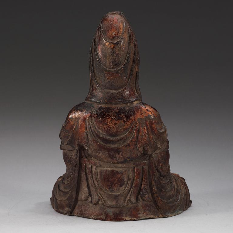 A cast iron figure of a seated Guanyin, presumably late Ming dynasty.
