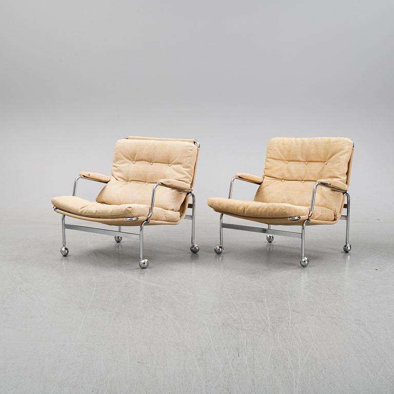 Bruno Mathsson, a pair of easy chairs and a coffee table, 'Karin', Dux, second half of the 20th Century.