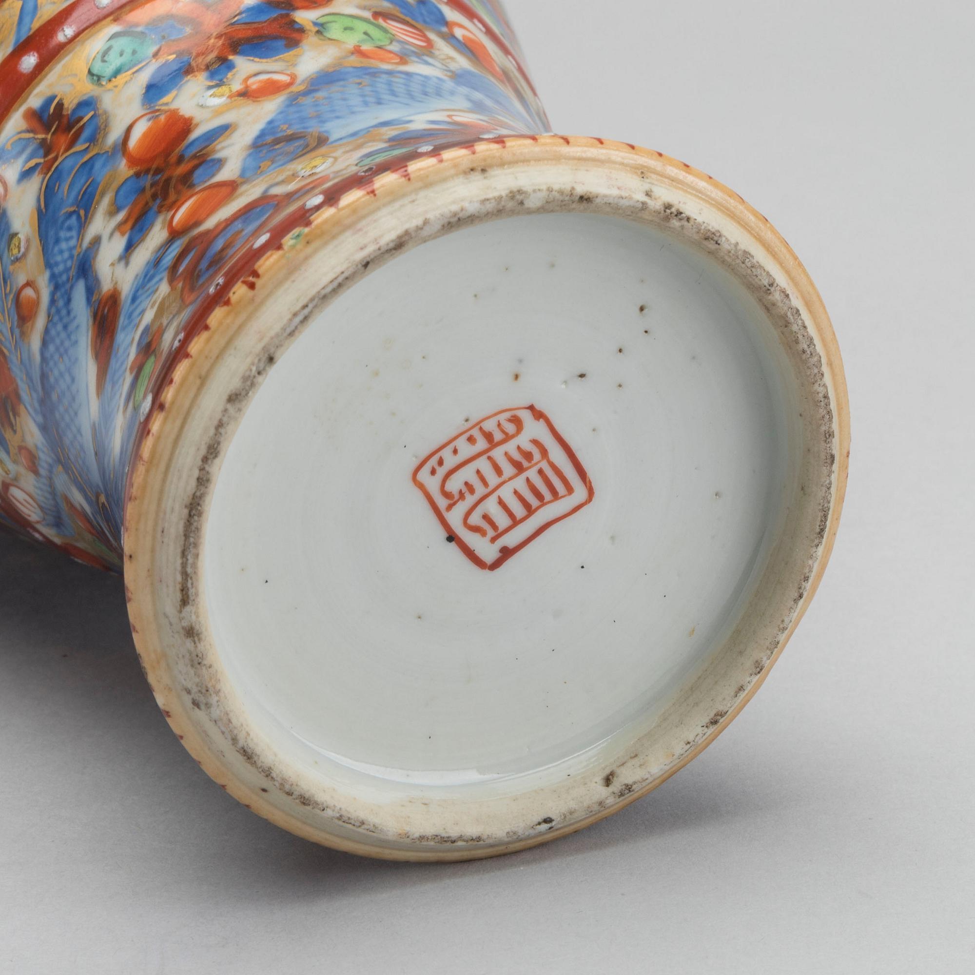 A Chinese clobbered 18th century porcelain vase, height ca 24 cm.