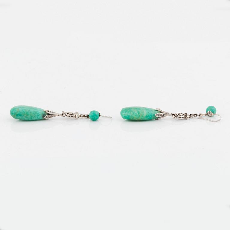 A pair of platinum earrings with amazonite.