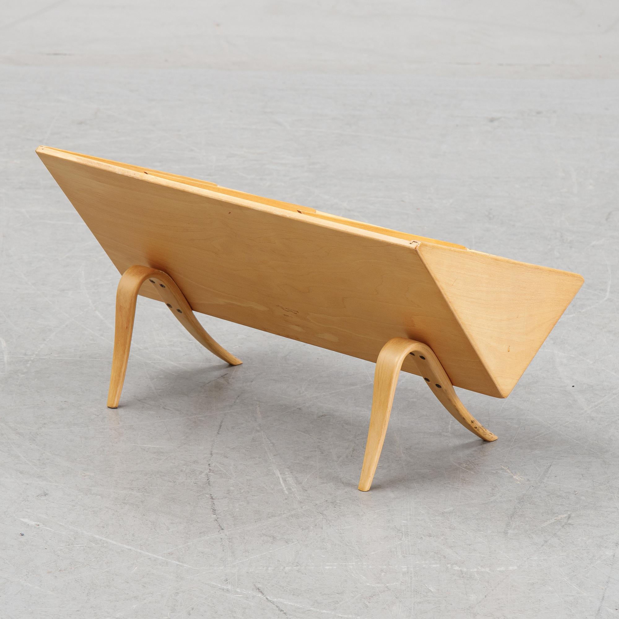 A model T 709 book stand by Bruno Mathsson for Firma Karl Mathsson, dated 1967.