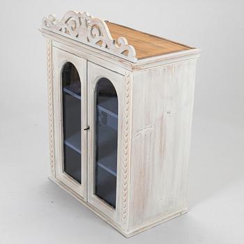 A late 19th-century wooden wall cabinet.