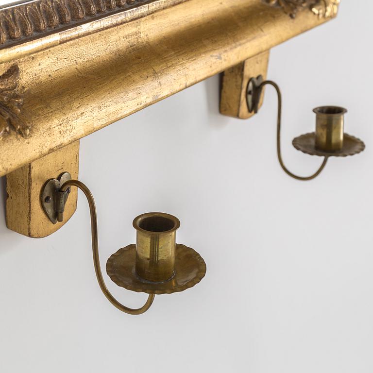 A mid 19th century empire gilt wood wall sconce for two candles.