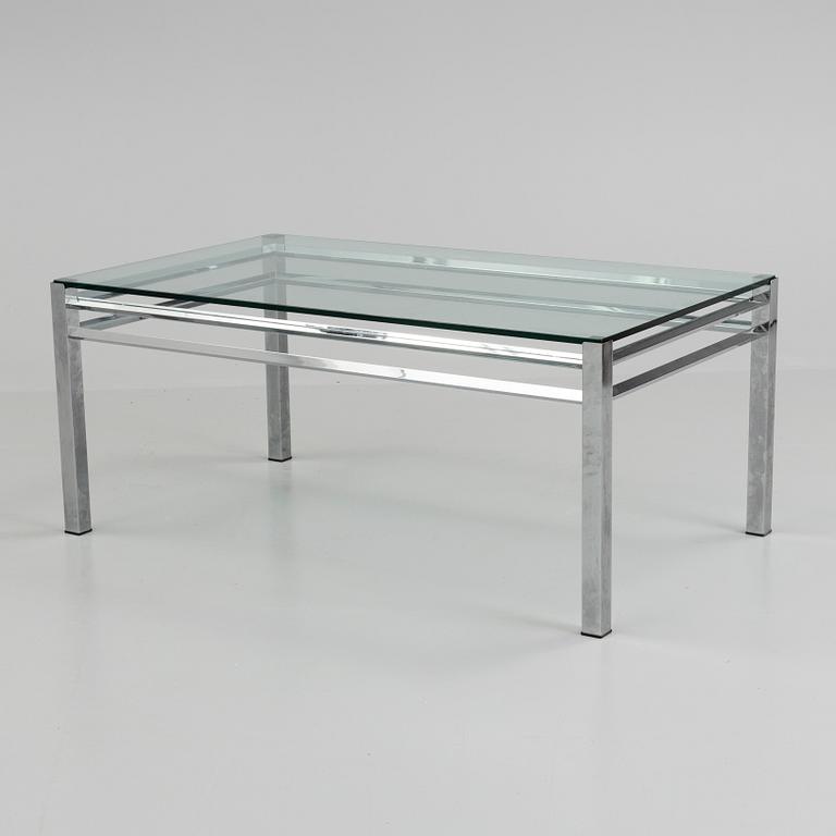 A 1980´s metal table with glass top.