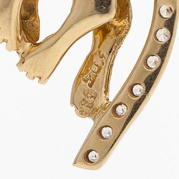 A 14K gold necklace with a panther pendant set with white stones.