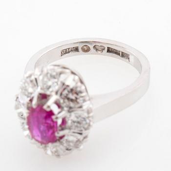 Ring Carmosé 18K white gold with an oval faceted ruby and round brilliant-cut diamonds, Reutners Ystad 1974.