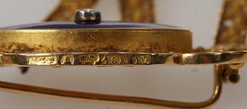 BROSCH, guld, 18k, emalj samt diamant, Stockholm, 1907. Vikt 12 gram.