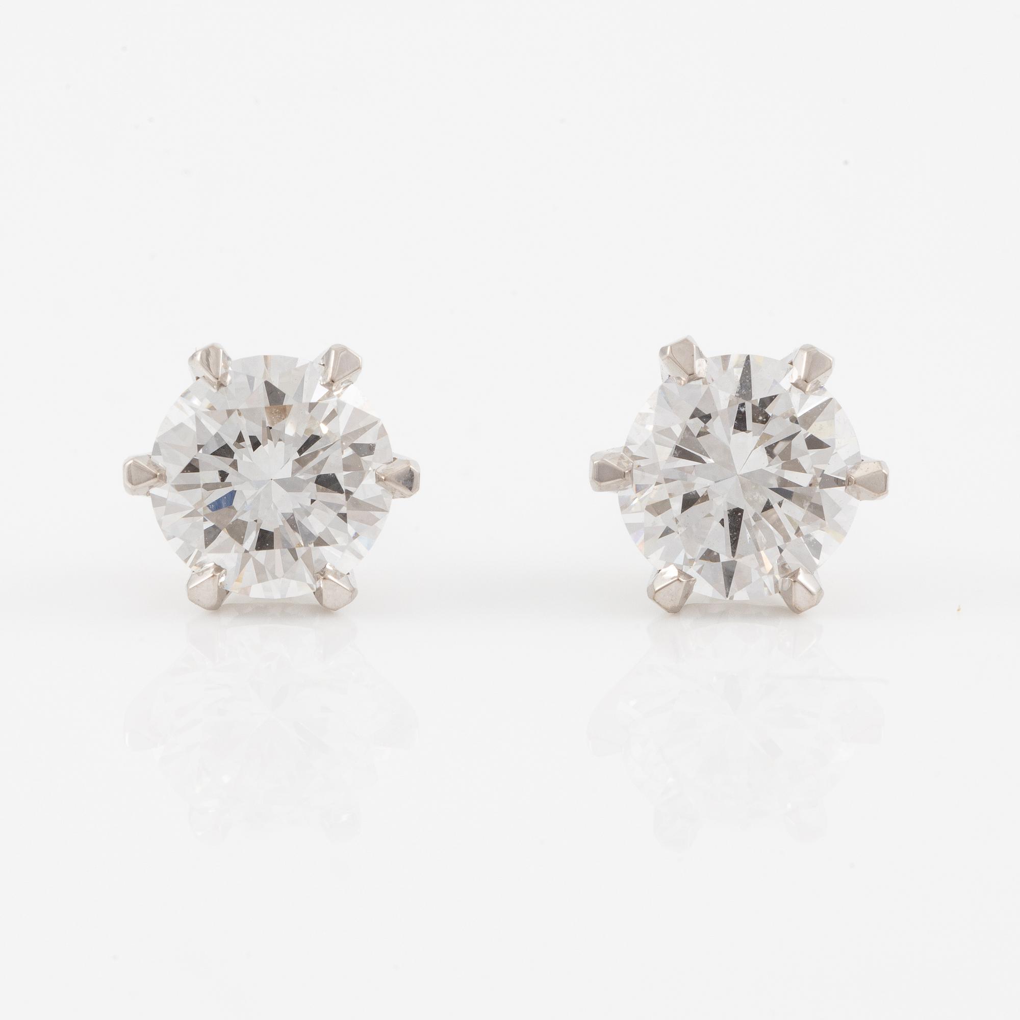 Brilliant-cut diamond stud earrings.