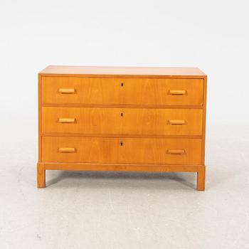 A 1940s elm chest of drawers.