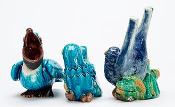 Three Gunnar Nylund stoneware figures, a pelican and two parrots, Rörstrand.