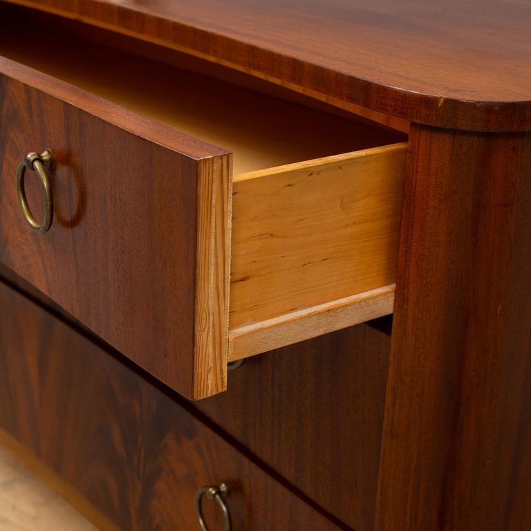 A 1940s Swedish Modern mahogany veneered chest of three drawers.