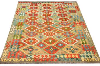 An Afghan Kilim carpet, c. 305 x 200 cm.