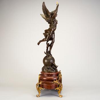 A mantel clock with sculpture "L'occident" after Émile Bruchon from the turn of the century 1800/1900.