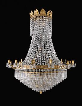 935. A Swedish Empire thirteen light chandelier.