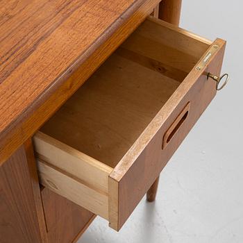 A teak-veneered desk, mid 20th century.