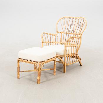 Josef Frank, wicker chair with stool model no. B 311 for Svenskt Tenn, second half of the 20th century.