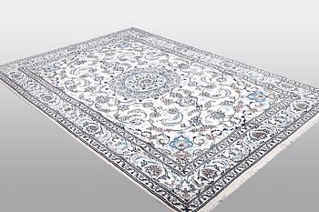 A carpet, Nain, 285 x 196 cm.