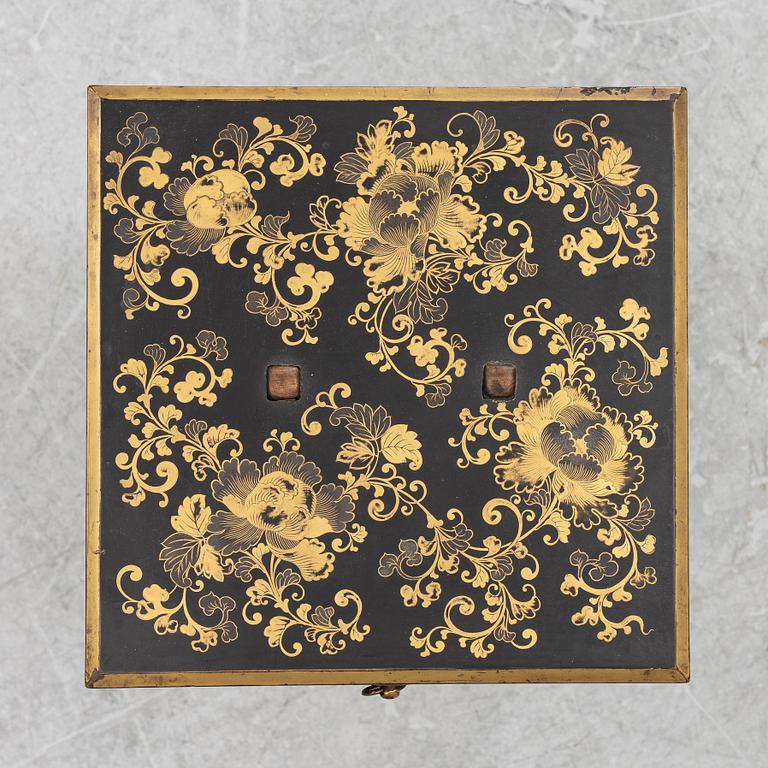 A lacquered end table/box with stand, Japan, 20th century.