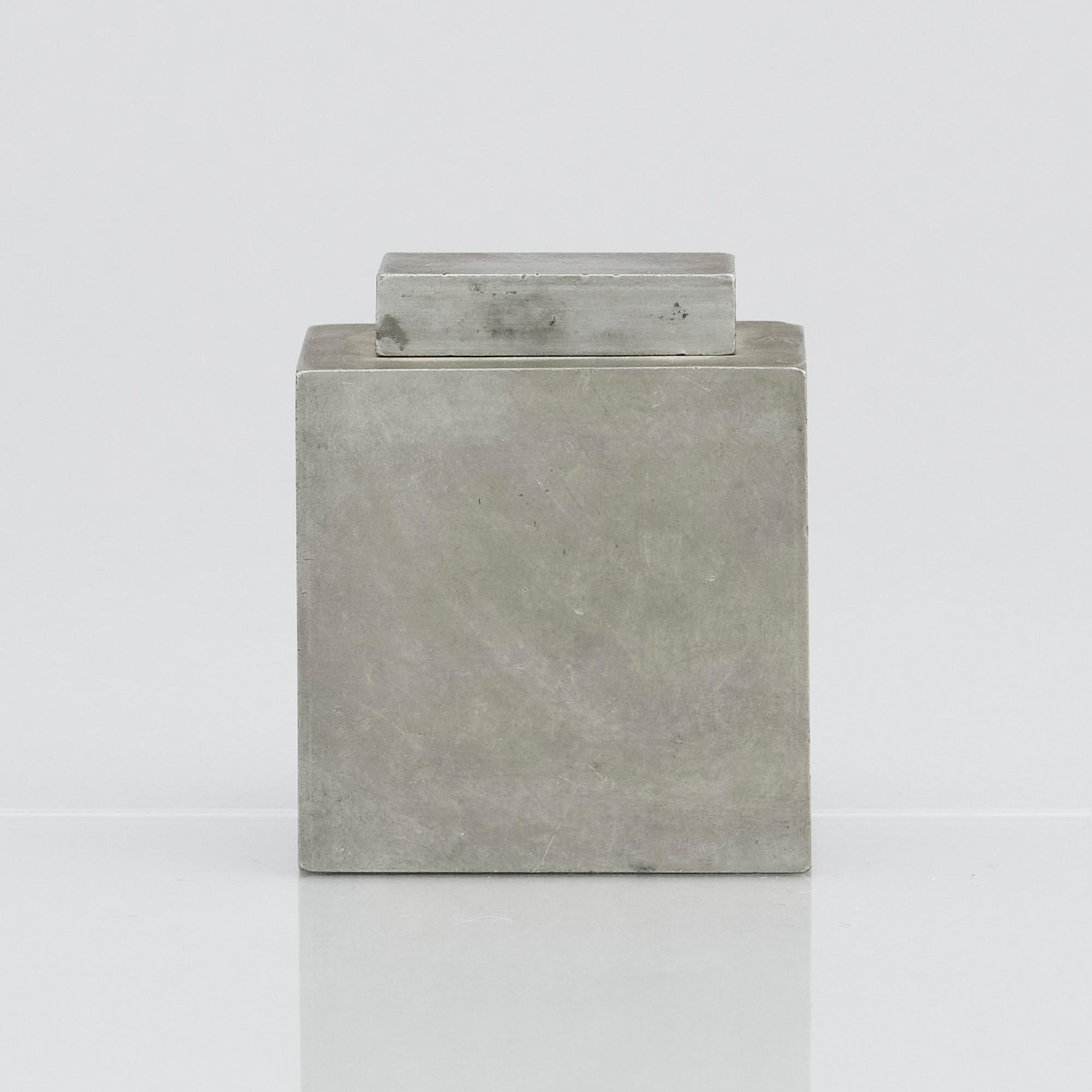 Firma Svenskt Tenn, a pewter lidded cannister with brass decor, Stockholm 1929.