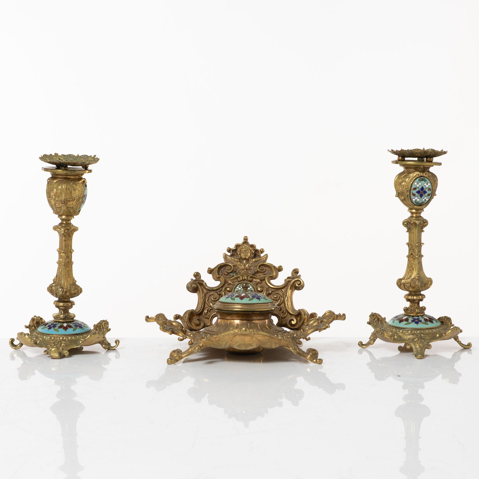 A pair candlesticks and an inkwell, circa 1900.