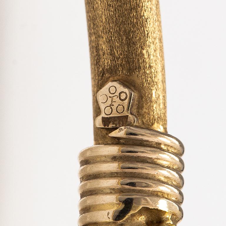 An 18K gold bracelet.
