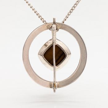 Elis Kauppi, A silver necklace/brooch with a tiger's eye. Kupittaan kulta, turku 1961.