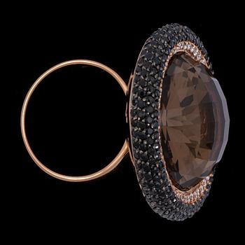 A citrine and black- and white diamond ring.