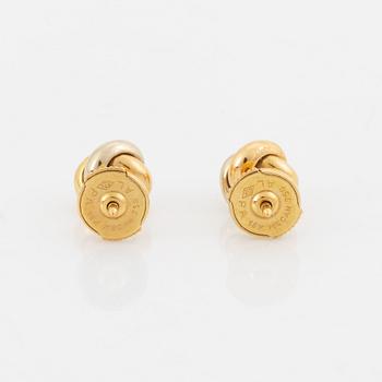 A pair of 18K gold Cartier "Trinity" earrings set with round brilliant-cut diamonds.