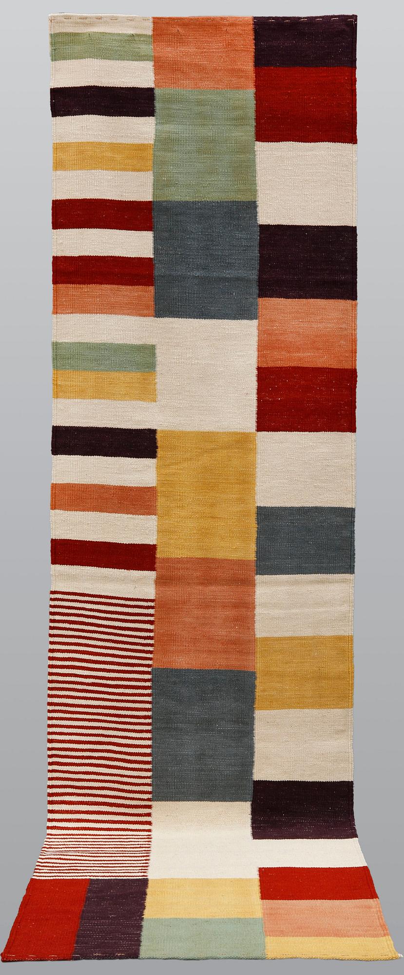 A carpet, flat weave, ca 292 x 80 cm.