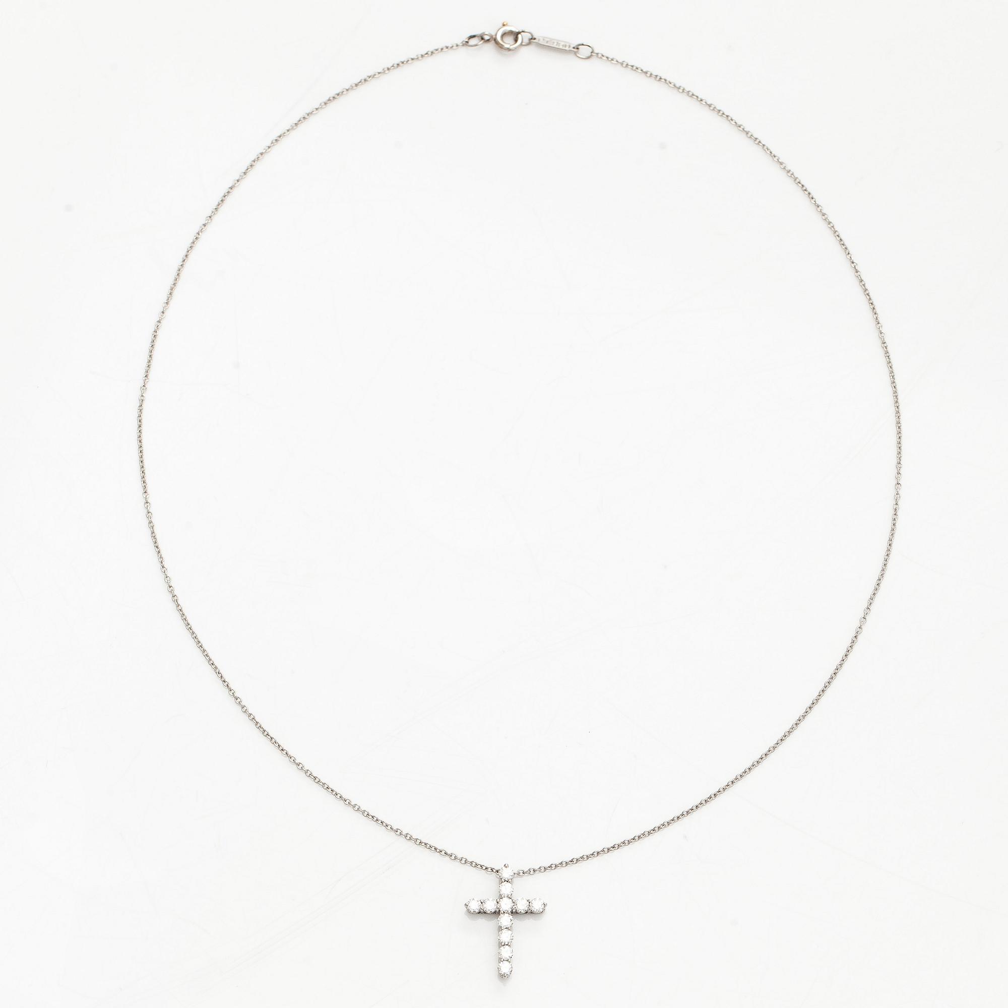 Tiffany & Co, a platinum cross pendant necklace with brilliant-cut diamonds.