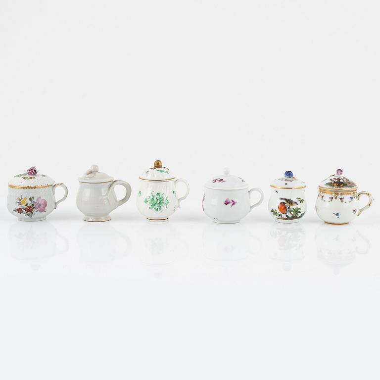 Two dinner plates and 11 custard cups with covers, 18th/20th Century.