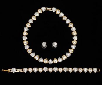 695. A set consisting of necklace, bracelet and a pair of earrings by Swarowski.
