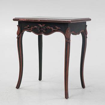 A painted table with a drawer, 20th Century.