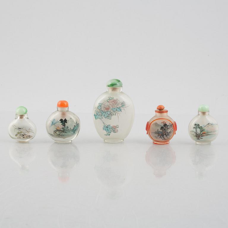 A group of nine Chinese glass and porcelain snuffbottles, 20th century.