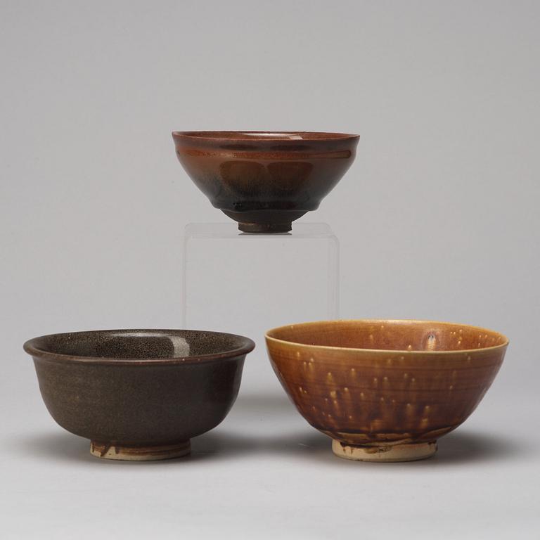 A group of three brown glazed bowls, China, 20th Century.