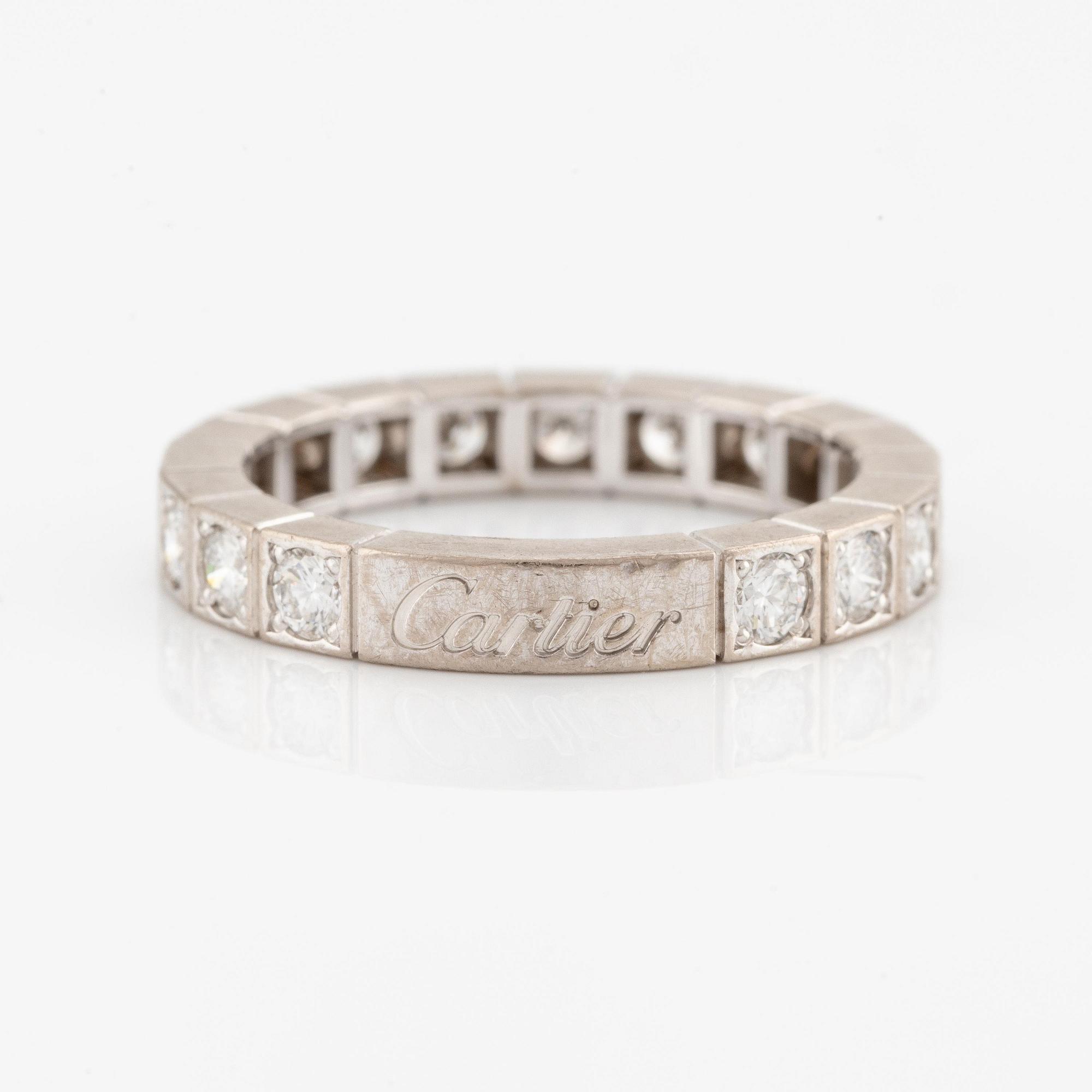 An 18K white gold Cartier ring set with round brilliant-cut diamonds.