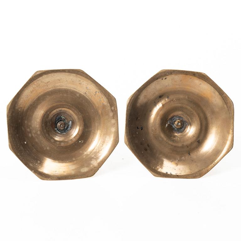 A pair of Swedish late baroque brass candlesticks, mid 18th century.