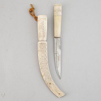 A reindeer horn Sami knife, signed SJ.