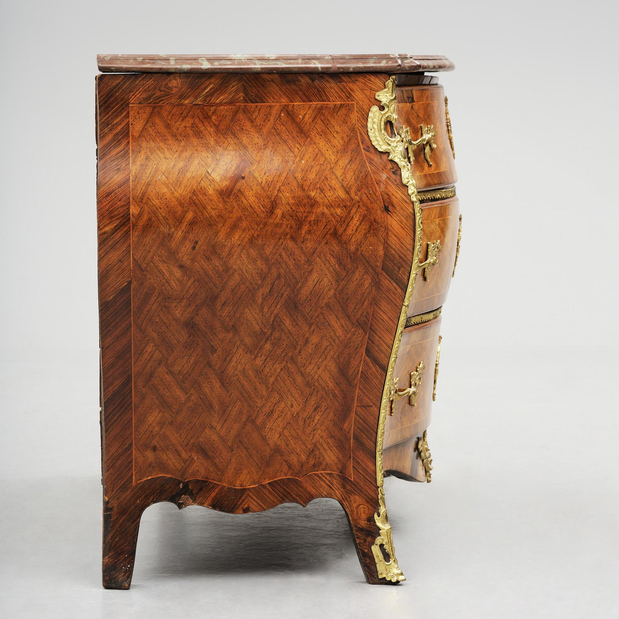 A parquetry and ormolu mounted rococo commode attributed to C. Tietze (master in Stockholm 1764.91).