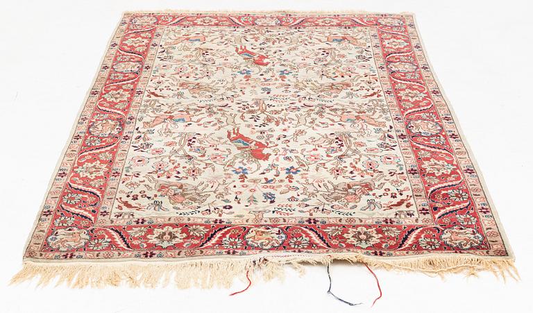 An oriental, figural rug, c. 230 x 145 cm.