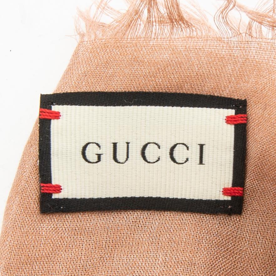 Gucci, belt and shawl.