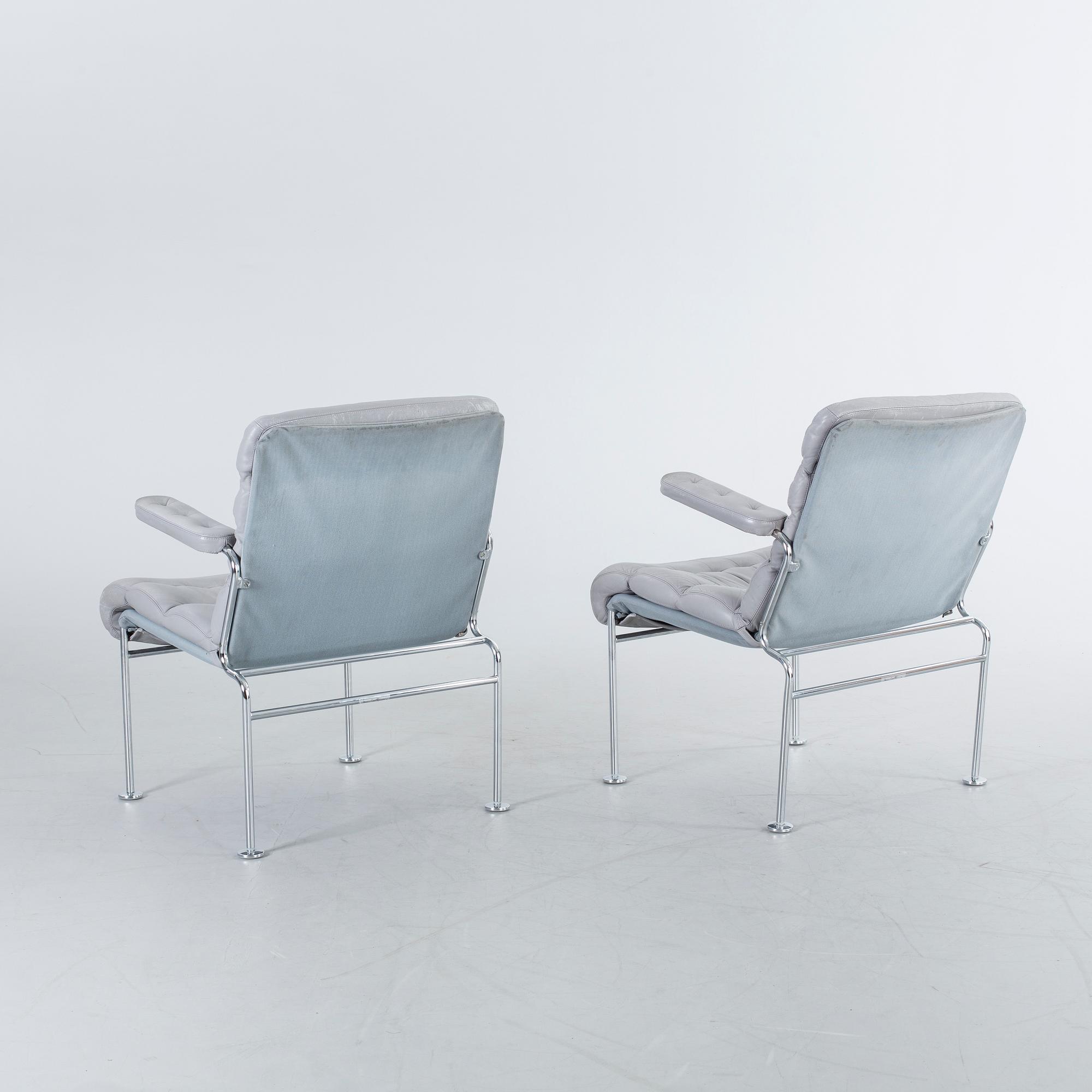 A COUPLE OF BRUNO MATHSSON ARMCHAIRS.