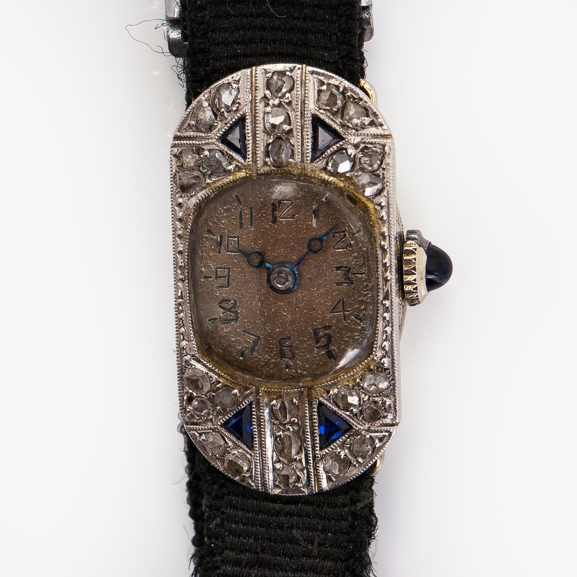 Wristwatch, 25 x 13 mm, Art Deco, rose cut diamonds, faceted sapphires, 18K white gold.