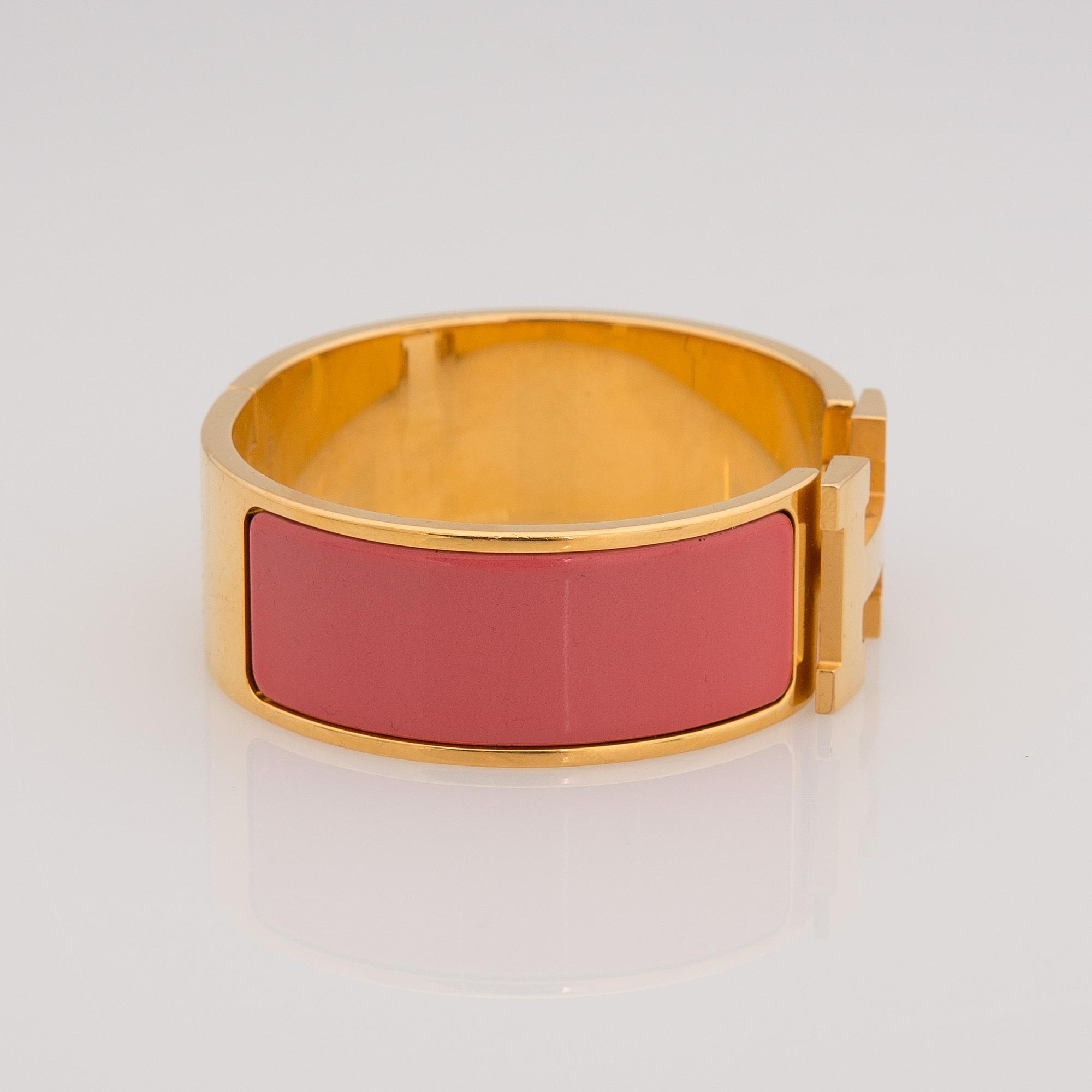 ARMBAND, bijouteri, Hermès "clic H", guldfärgad metall.